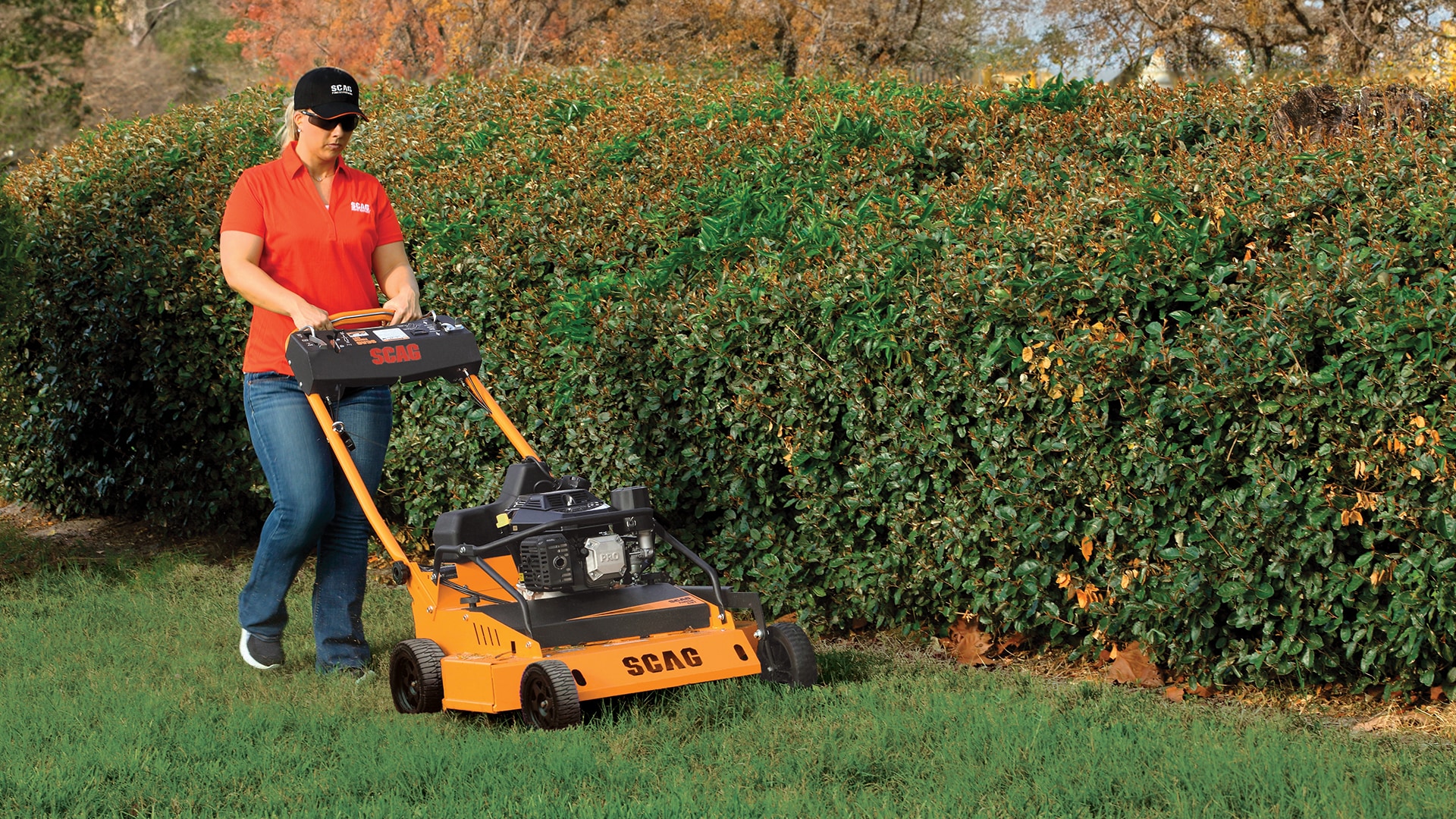 Woman pushing a SFC-30 mower